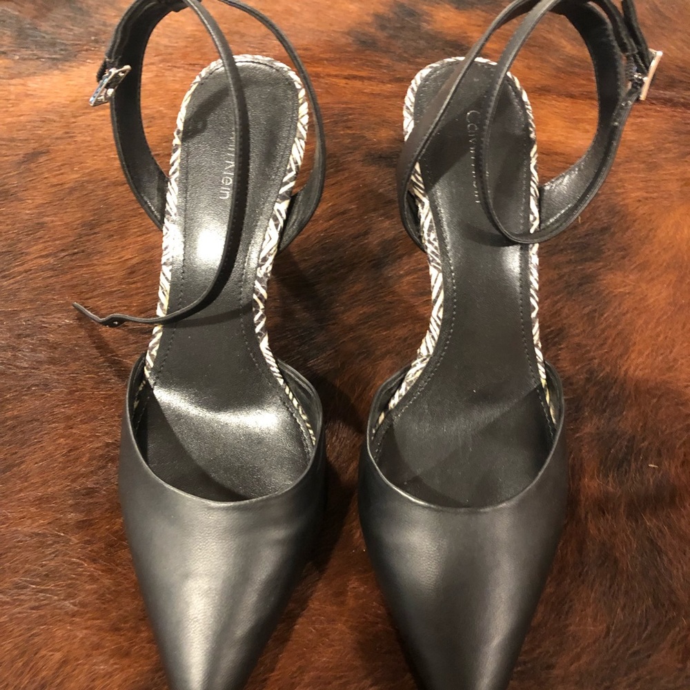 Black shoes with heeled design.